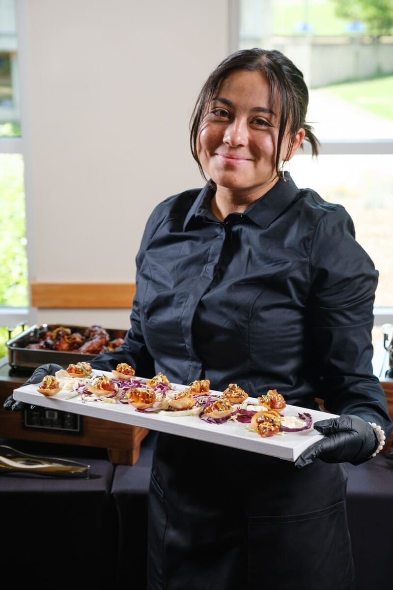 Server holding a plate or hors devours