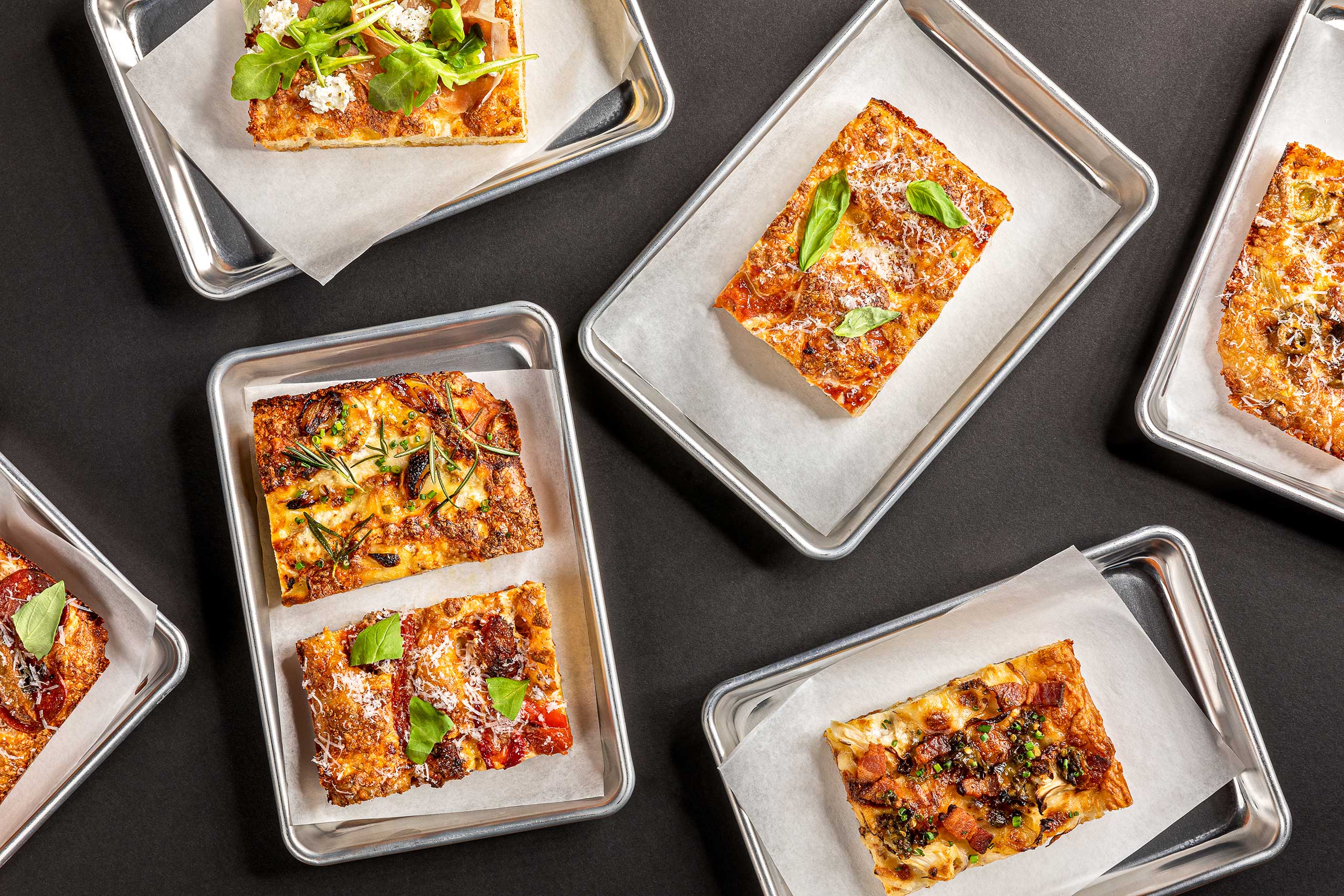 Overhead view of assorted pizza slices